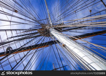 Old naval ship mast and sail ropes detail. Old ship mast and sail ropes closeup