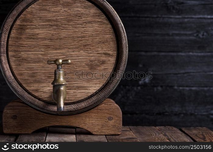Old oak barrel on wooden table still life with copy space