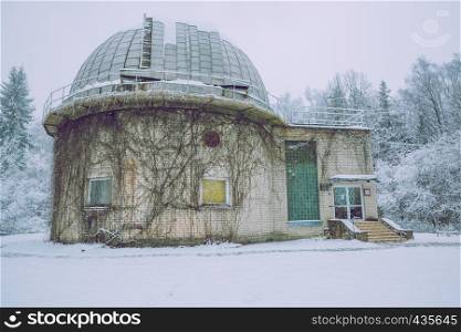 Old observatory at Latvia, city Baldone. Winter, snow and building. Travel photo 2016.