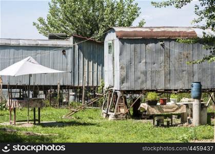 Old obsolete wagons used for homes in fishing settlement