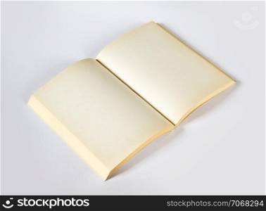 Old open blank book mockup, isolated on grey. Top view. Old open blank book isolated on grey