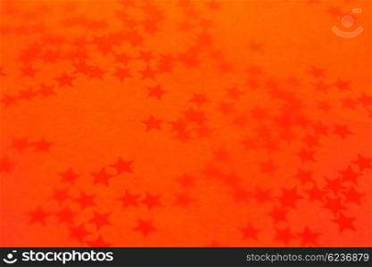 Old orange holiday wallpaper with a stars
