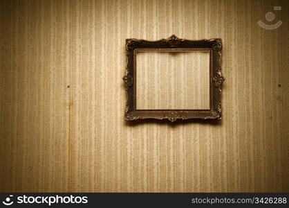 Old ornamented frame on retro grunge wall