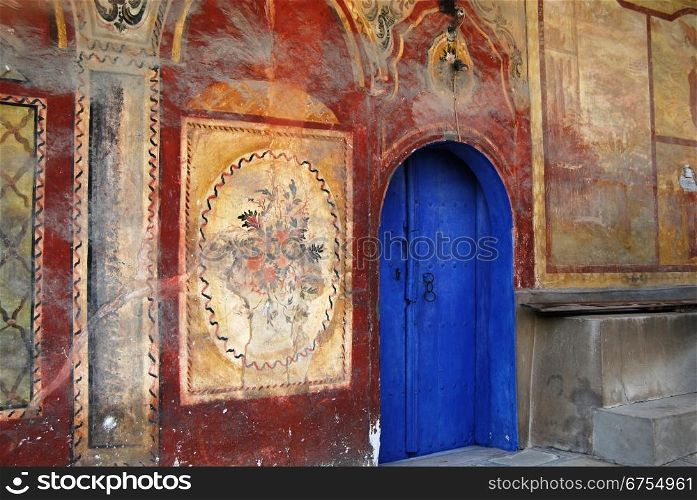 Old orthodox monastery blue wooden back door