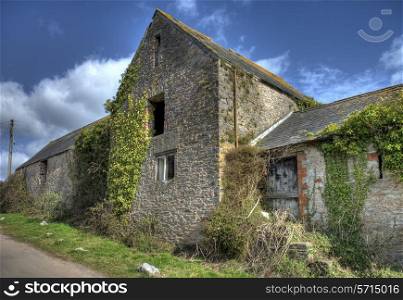 Old overgrown barns at Churston Ferrers, Devon, England.