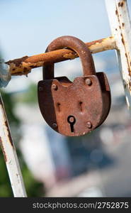 Old padlock. Iron, rusty lock on blur a background