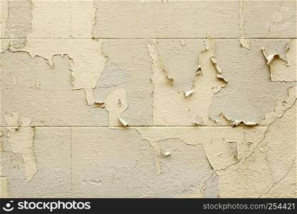 Old painted wall peeling, detail of neglect and ruin