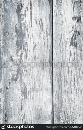 Old painted wood background. Textured background of distressed rustic wood with peeling blue and white paint