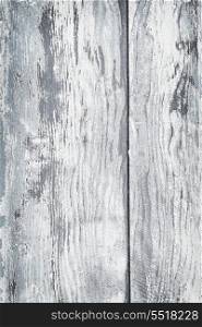 Old painted wood background. Textured background of distressed rustic wood with peeling blue and white paint