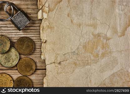 Old paper and coins on a wooden table
