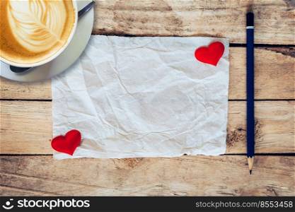old paper and red heart, coffee cup with pencil on wood background for valentine greeting card.