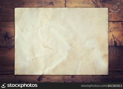 Old paper on wood background vintage with space