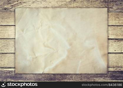 Old paper on wood background vintage with space