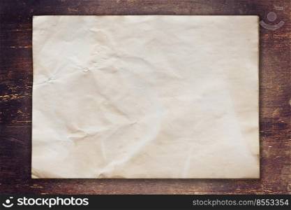 old paper on wood background with space