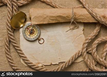 old paper with compass and rope on canvas