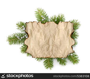 Old parchment paper with copy space on Christmas tree branch background isolated