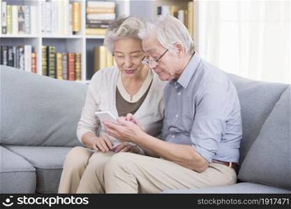 Old people in the East using a mobile phone