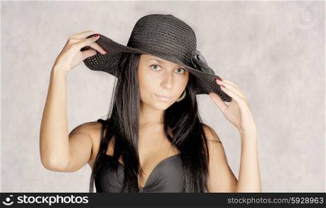 Old photo stylization young women in hat.