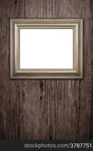 Old picture frame on vintage wood wall.