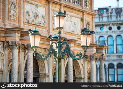 Old pink lantern at famous Piazza San Marco in Venice, Italy