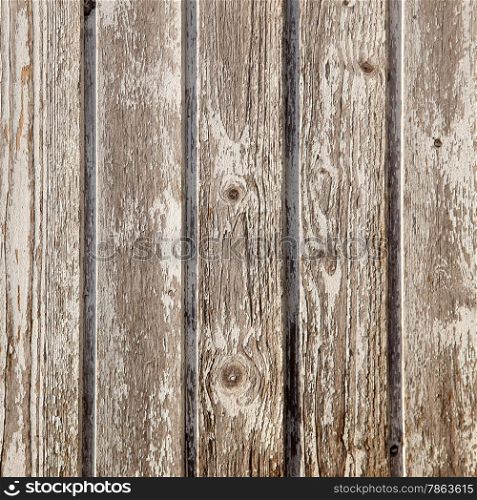 old planks of garden shed with peeling white paint on square image