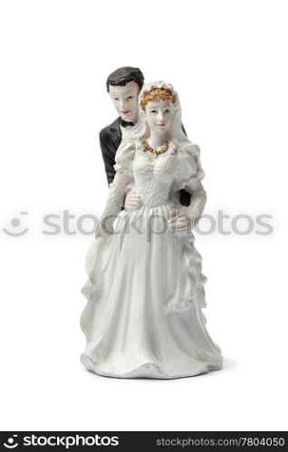 Old plaster bride and groom cake topper isolated on white background