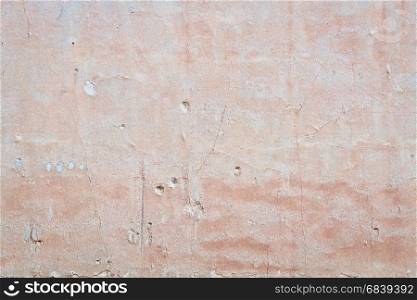 old plaster wall background and texture with holes and cracks