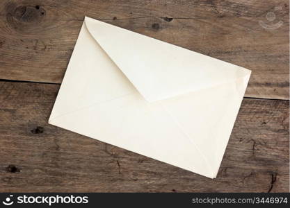 old postal envelope on wooden background