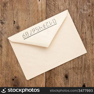 old postal envelope on wooden background