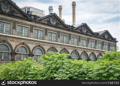 old power plant -in St Louis riverfront - windows and brick walls wirh sandstone decoration