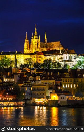 Old Prague cityscape with the Charles bridge after sunset