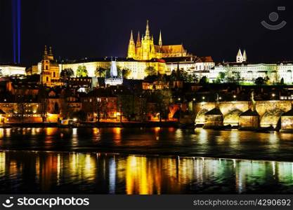 Old Prague cityscape with the Charles bridge after sunset
