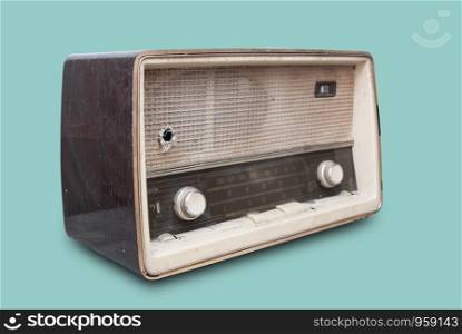 Old radio isolate on green background