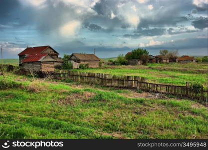 old ranch on a green field HDR