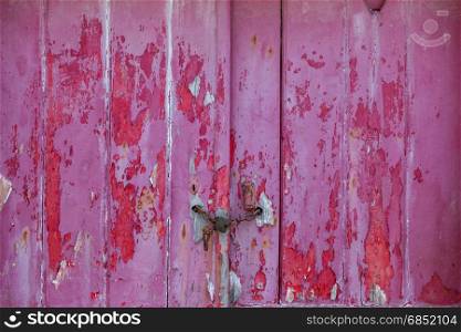 old raspberry colorer door with damaged texture