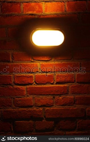 Old red brick wall with street light background