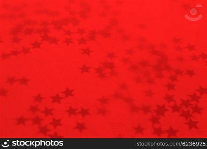 Old red holiday wallpaper with a stars
