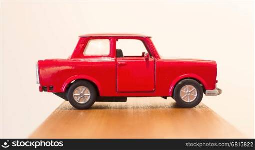 Old red toy car, isolated, selective focus