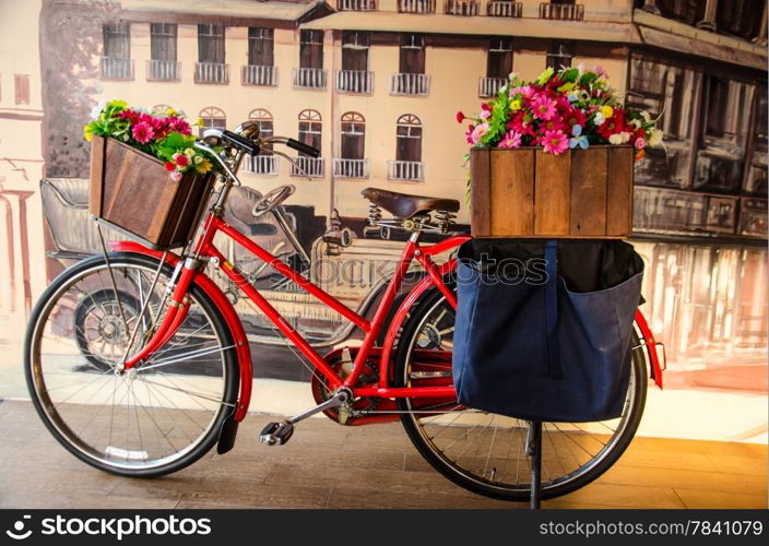 old red vintage bicycle with flower