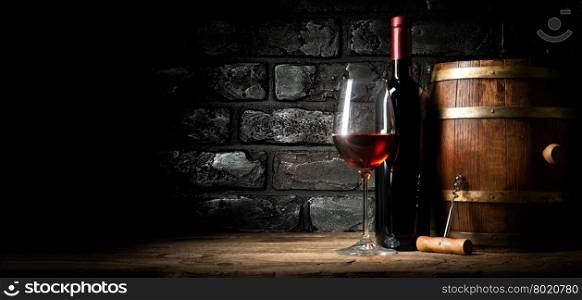Old red wine near black brick wall
