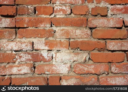 Old red with hollows a brick wall of the house a structure