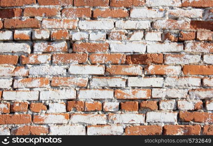 Old red with hollows a brick wall of the house a structure