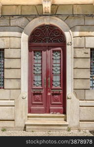 old red wooden door in house Portugal