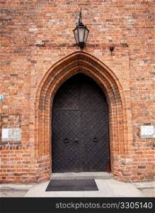 Old restored church of the Visitation of the Virgin Mary in New Town Warsaw in Poland with the solid door