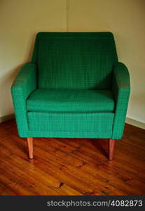 Old retro chair, covered with green cloth
