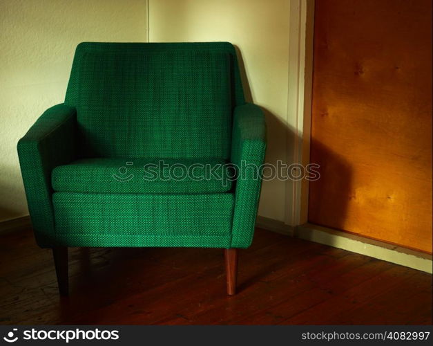 Old retro chair, covered with green cloth