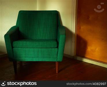 Old retro chair, covered with green cloth