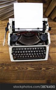 Old retro typewriter on wooden desk