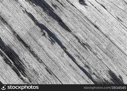 old rough textured grey wooden planks diagonally placed