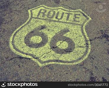 Old Route 66 sign on the asphalt.. Historic U.S. old Route 66 sign on the asphalt.